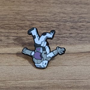 Astronaut Hard Enamel Pin. This pin is out of this world with a space design. White grey and purple colours on this guy.